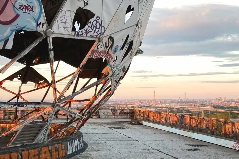 Graffiti-covered radar dome on Teufelsberg with a view over Berlin