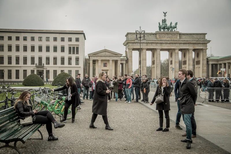 Treasure hunt players on Pariser Platz in front of the Brandenburg Gate